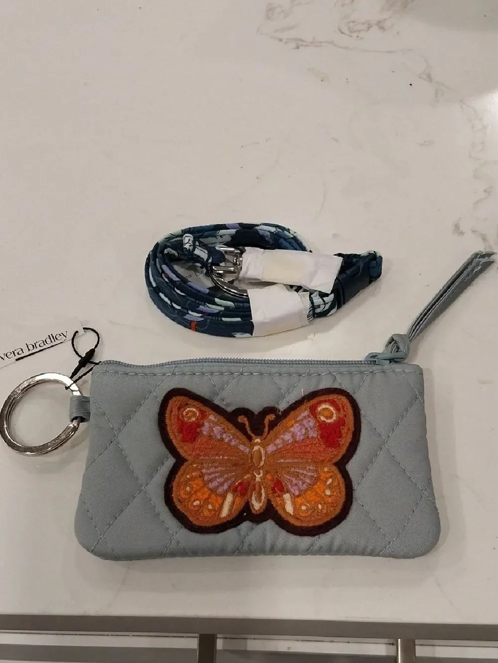 Vera Bradley Light Blue Quilted Wristlet with Orange Butterfly Patch And Lanyard